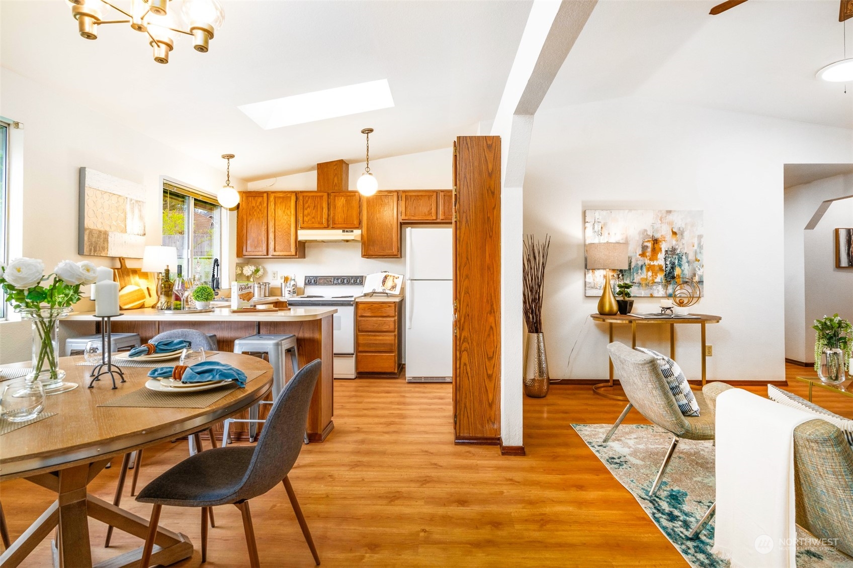 532 167th Street Southeast Bothell, WA 98012 - Photo 5 of 21 a dining room filled a chandelier and kitchen view