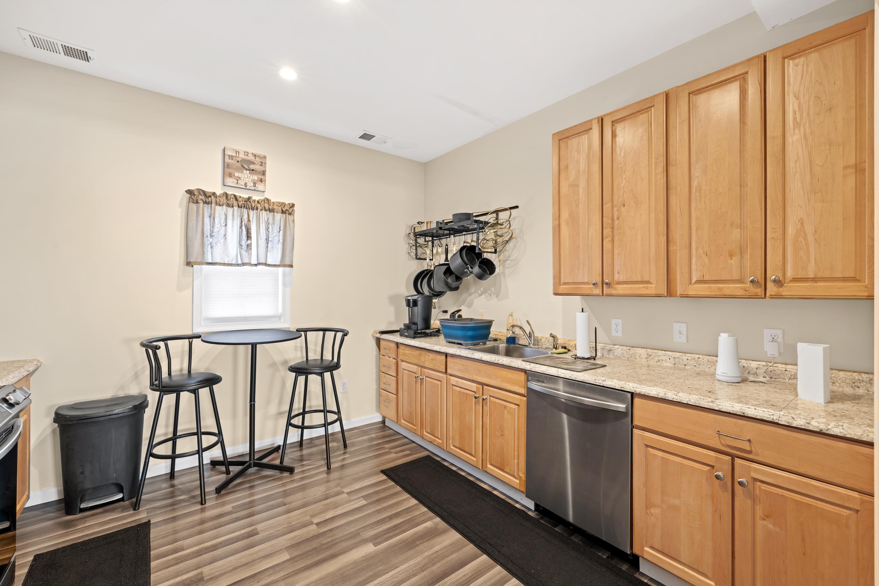 493 Railroad Avenue Goshen, VA 24439 - Photo 14 of 66 a kitchen with a sink cabinets and window