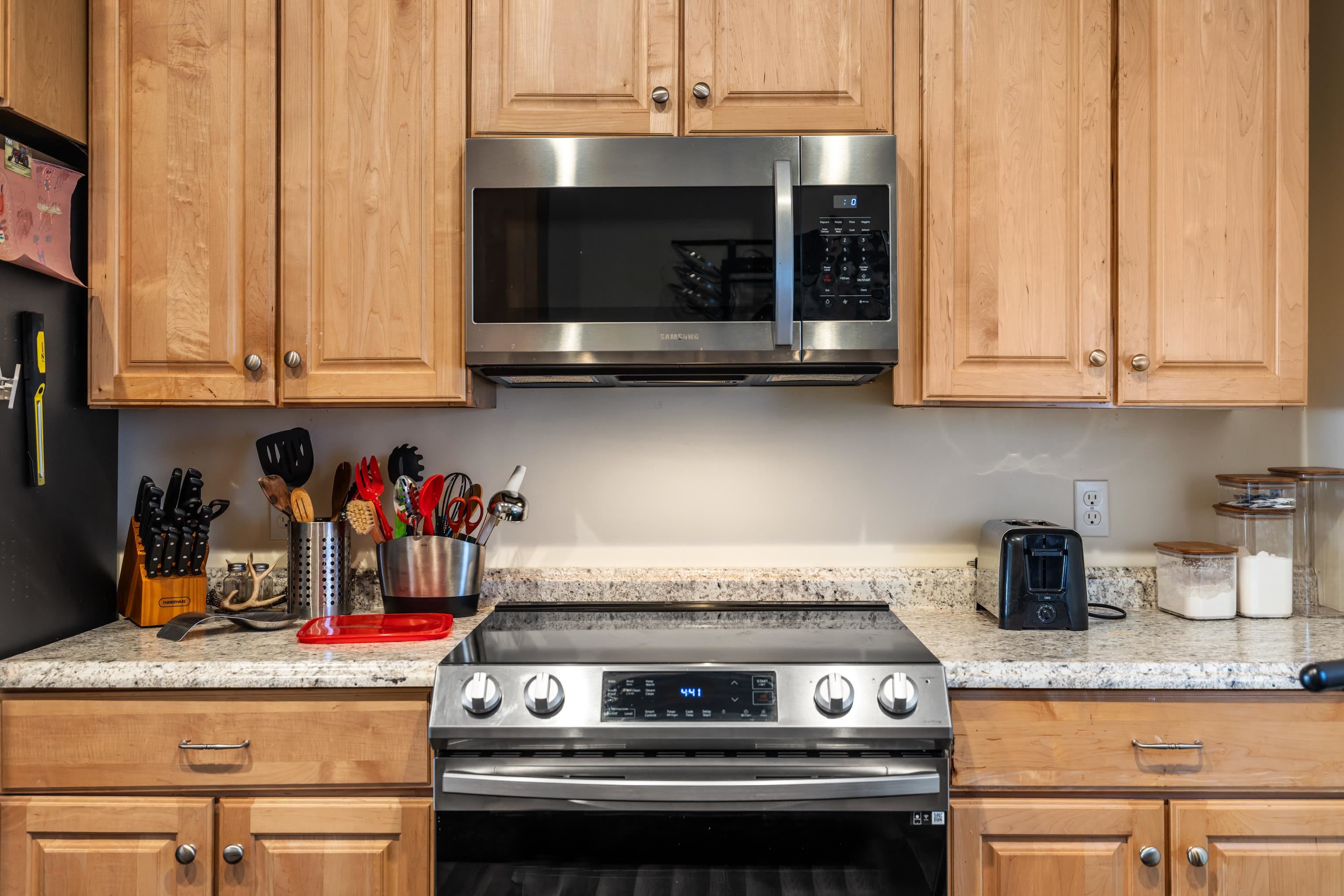 493 Railroad Avenue Goshen, VA 24439 - Photo 15 of 66 a kitchen with a stove and a microwave
