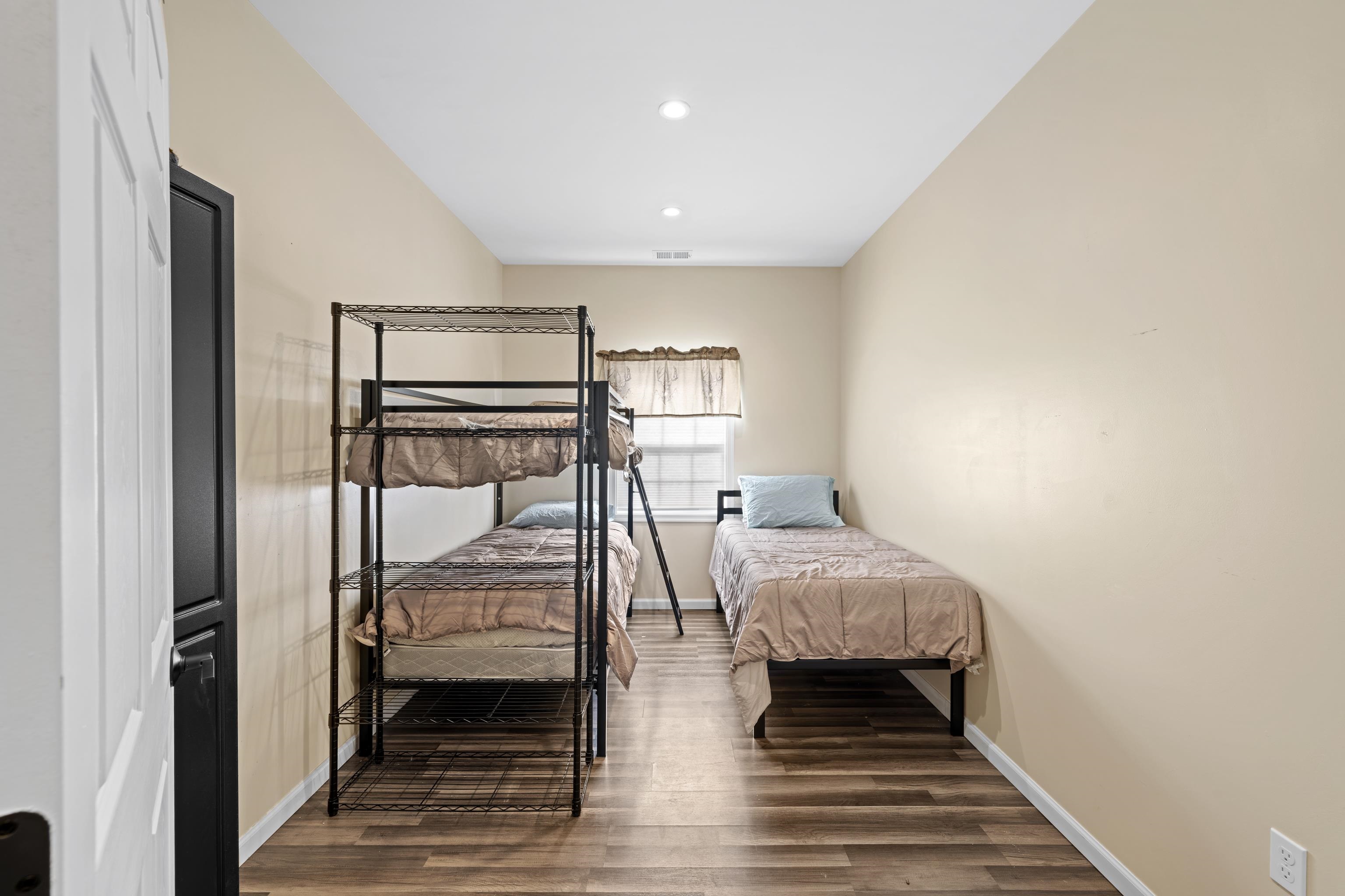 493 Railroad Avenue Goshen, VA 24439 - Photo 19 of 66 a bedroom with a bed and a window