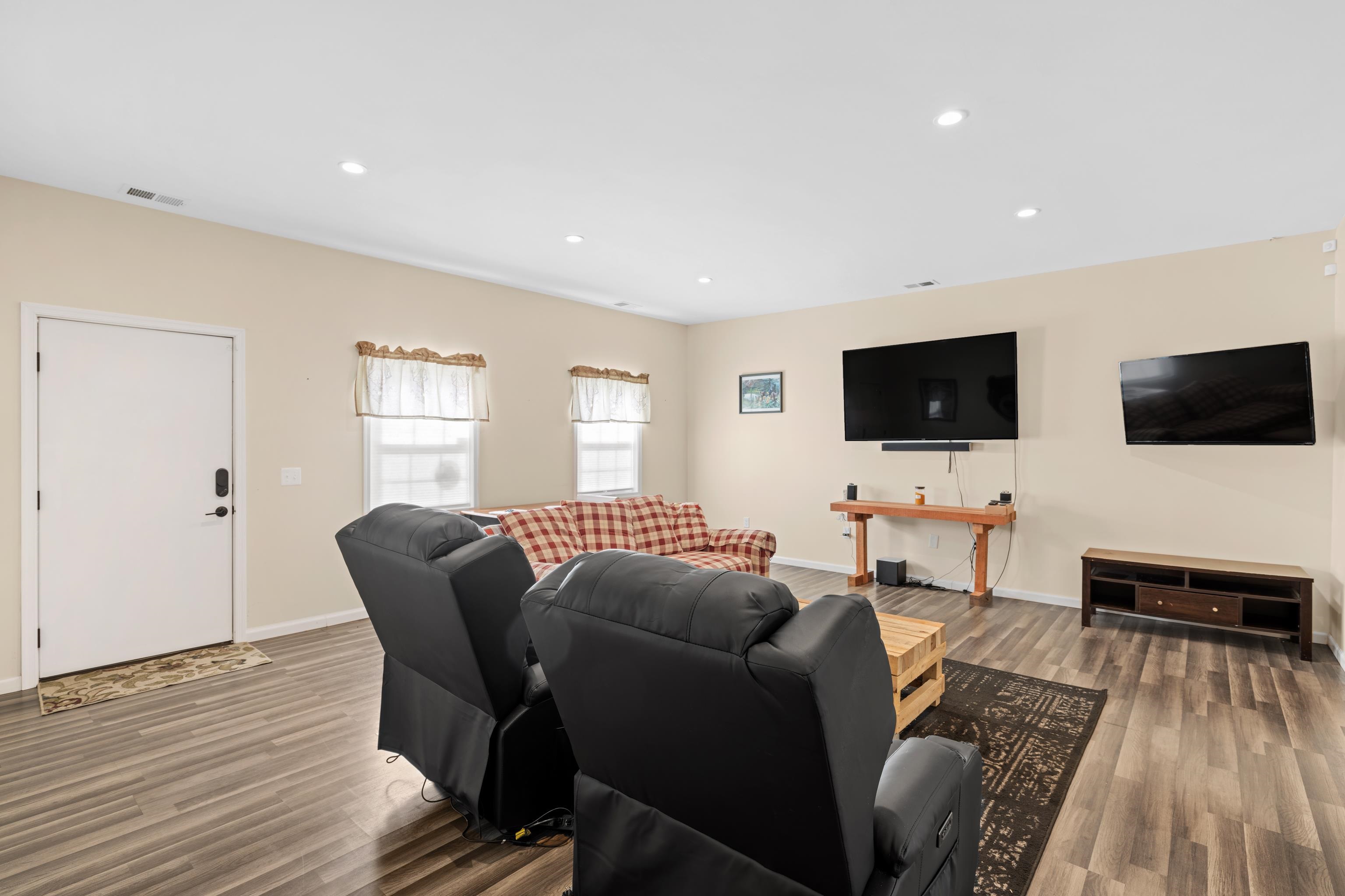 493 Railroad Avenue Goshen, VA 24439 - Photo 22 of 66 a living room with furniture and a flat screen tv