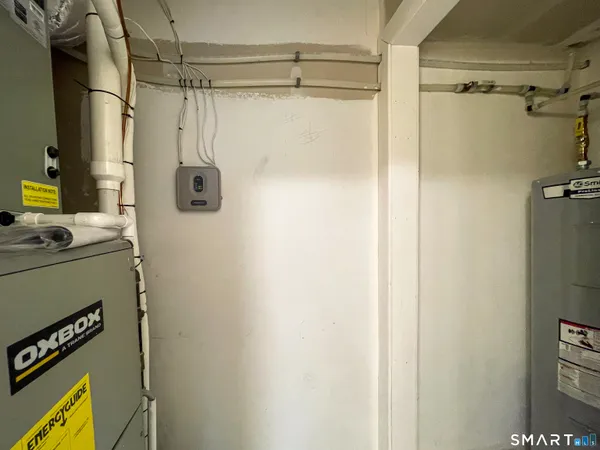 a bathroom with a shower a mirror and a sink