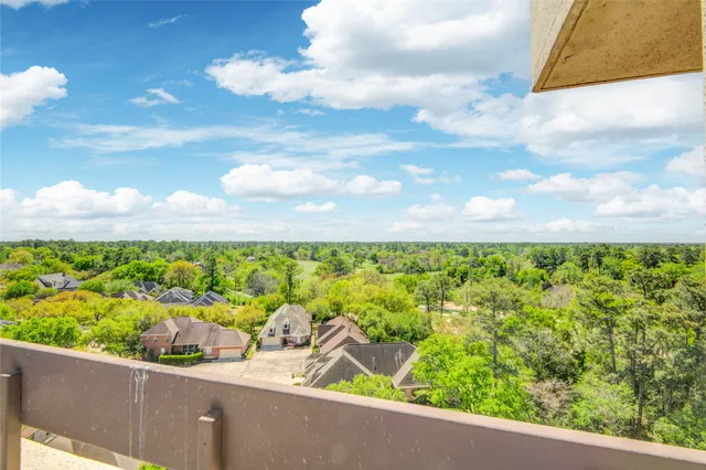 a view of a garden from a balcony