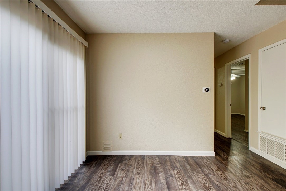 2003 Pipers Field Drive, Unit A Austin, TX 78758 - Photo 14 of 25 a view of a hallway with wooden floor