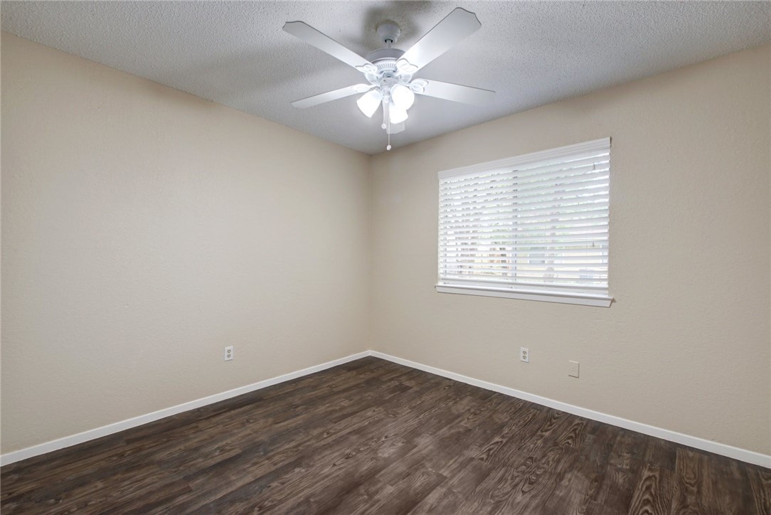 2003 Pipers Field Drive, Unit A Austin, TX 78758 - Photo 15 of 25 wooden floor in an empty room with a window