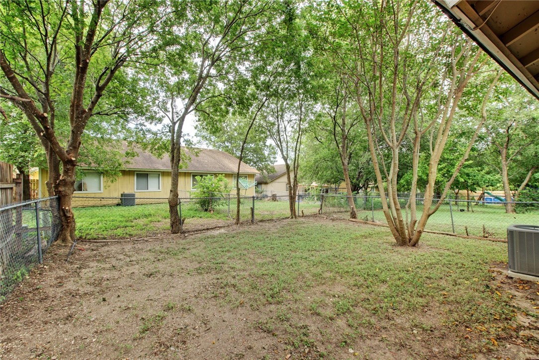 2003 Pipers Field Drive, Unit A Austin, TX 78758 - Photo 24 of 25 a view of a yard with tree s