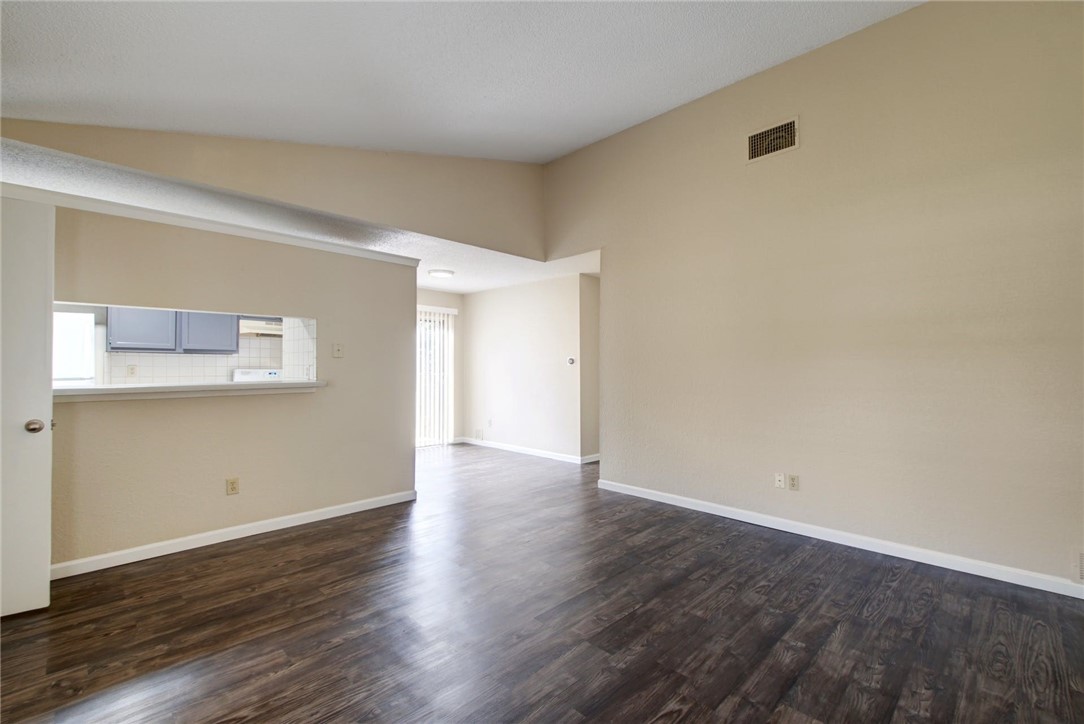 2003 Pipers Field Drive, Unit A Austin, TX 78758 - Photo 4 of 25 a view of an empty room with wooden floor