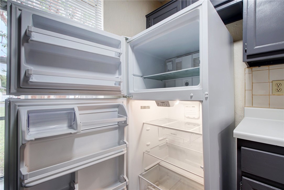 2003 Pipers Field Drive, Unit A Austin, TX 78758 - Photo 10 of 25 a view of walk in closet with empty racks