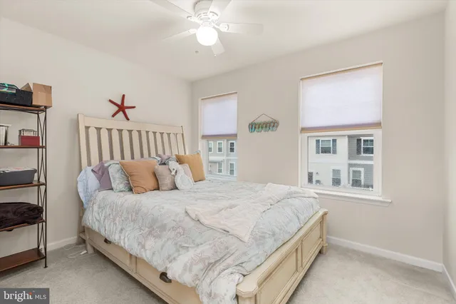 a kitchen with kitchen island granite countertop a refrigerator stove top oven and sink