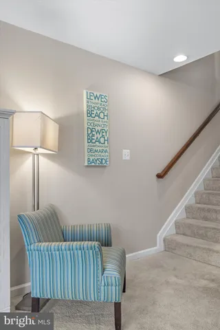 a kitchen with stainless steel appliances granite countertop a stove top oven a sink dishwasher and a refrigerator with wooden floor