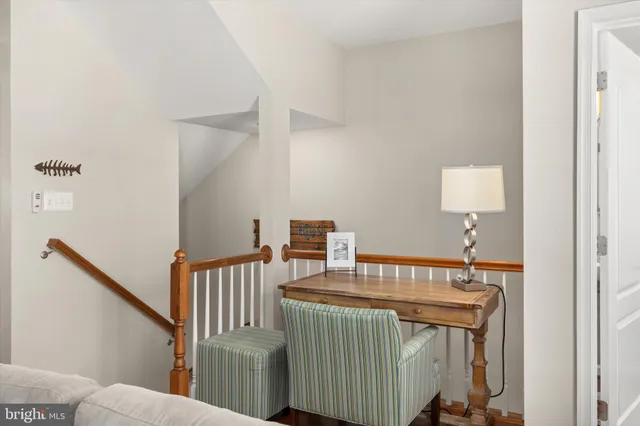 a spacious bathroom with a toilet a sink and mirror