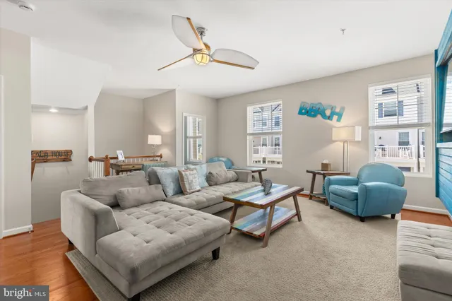 a view of a balcony with wooden floor and fence