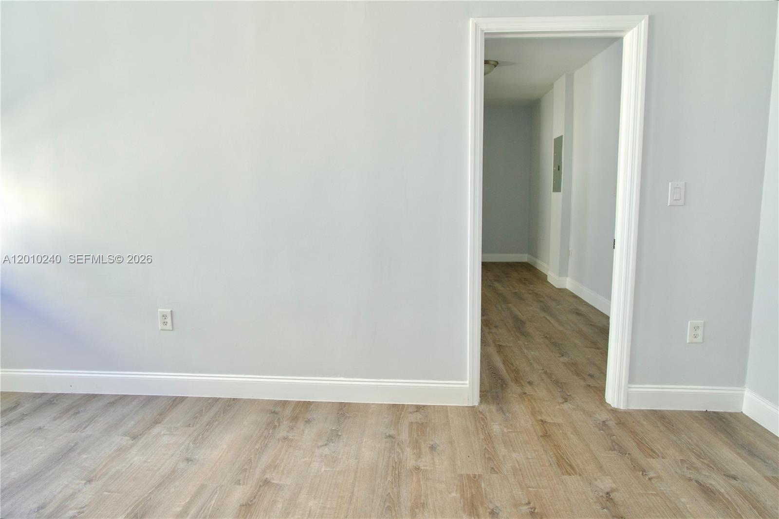 1142 Southwest 4th Street, Unit 17 Miami, FL 33130 - Photo 11 of 20 a view of an empty room with wooden floor