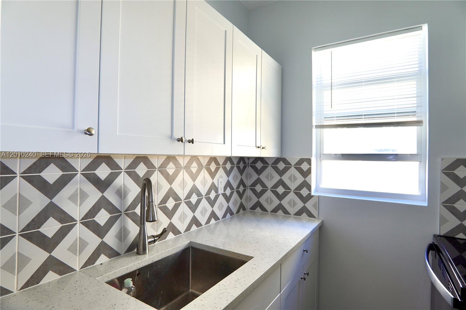 1142 Southwest 4th Street, Unit 17 Miami, FL 33130 - Photo 14 of 20 a utility room with a window