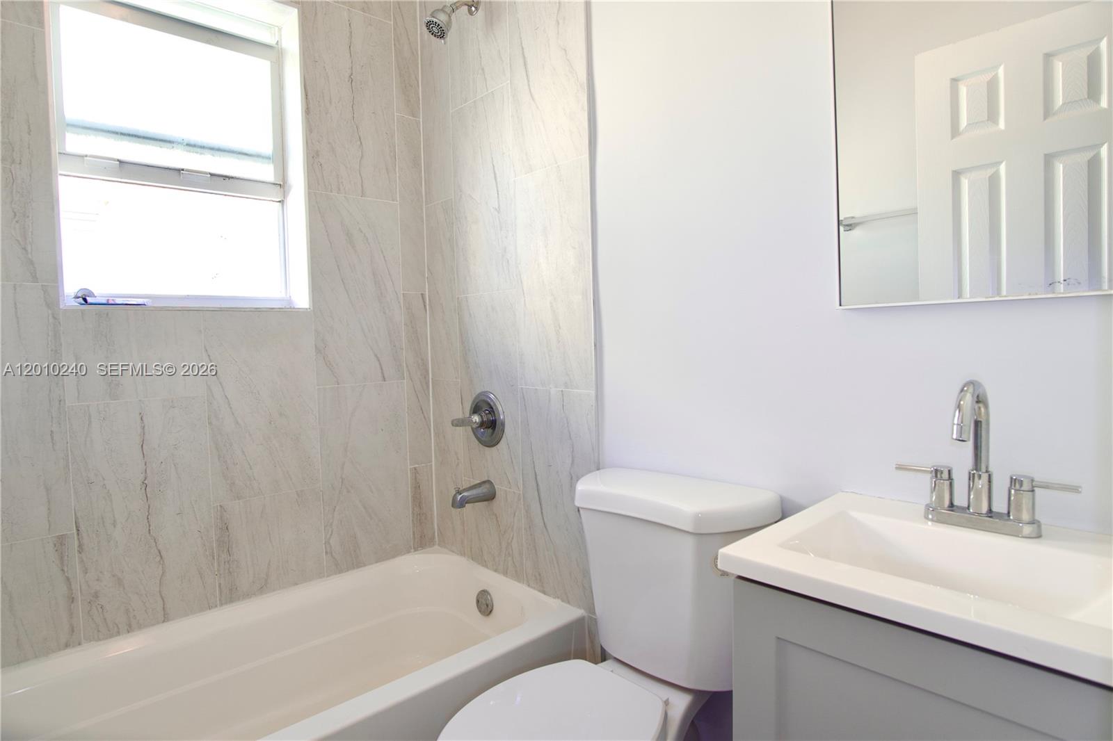 1142 Southwest 4th Street, Unit 17 Miami, FL 33130 - Photo 15 of 20 a bathroom with a sink toilet and shower