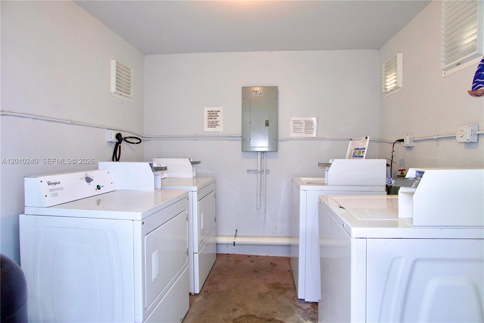 1142 Southwest 4th Street, Unit 17 Miami, FL 33130 - Photo 16 of 20 a utility room with dryer and washer