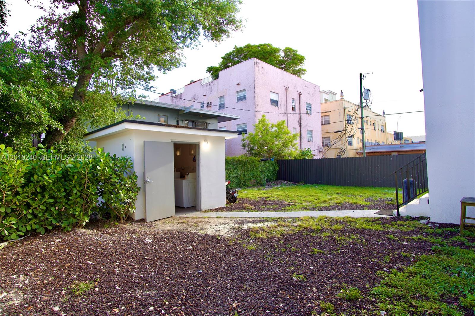 1142 Southwest 4th Street, Unit 17 Miami, FL 33130 - Photo 20 of 20 a view of a house with a yard and plants