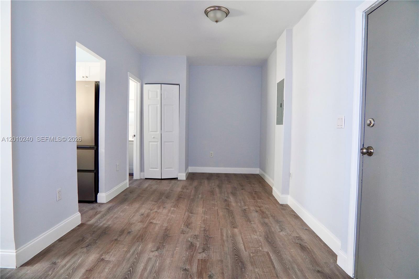 1142 Southwest 4th Street, Unit 17 Miami, FL 33130 - Photo 5 of 20 a view of a hallway with wooden floor
