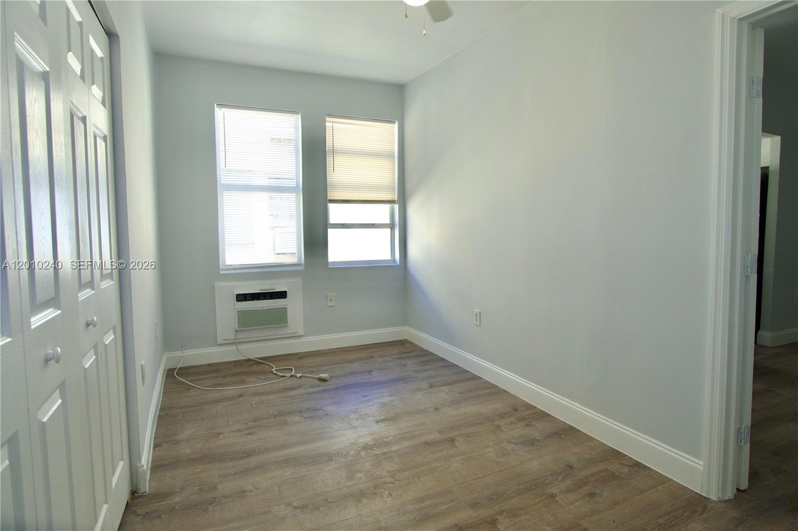 1142 Southwest 4th Street, Unit 17 Miami, FL 33130 - Photo 7 of 20 an empty room with windows