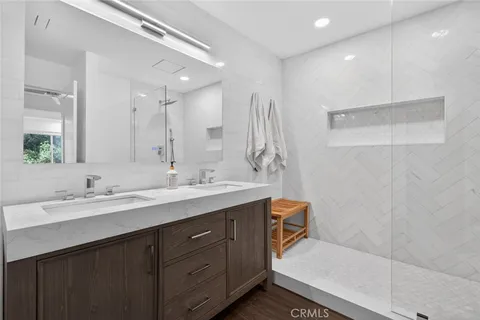 a bathroom with a double vanity sink mirror and double
