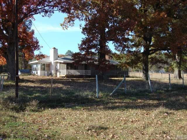 8715 North Roxboro Road Bahama, NC 27503 - Photo 1 of 1 a front view of a house with garden