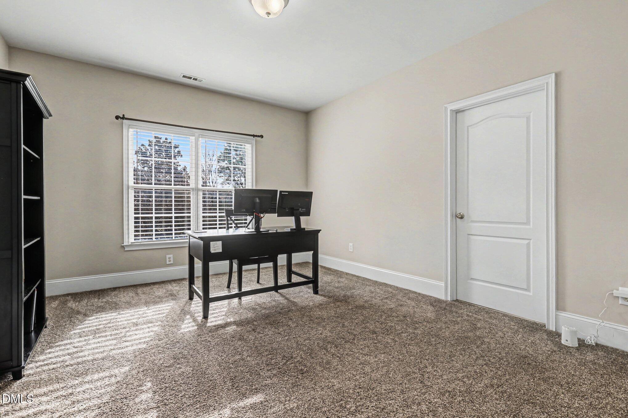 10643 Tarton Fields Circle Raleigh, NC 27617 - Photo 23 of 53 a view of a livingroom with furniture