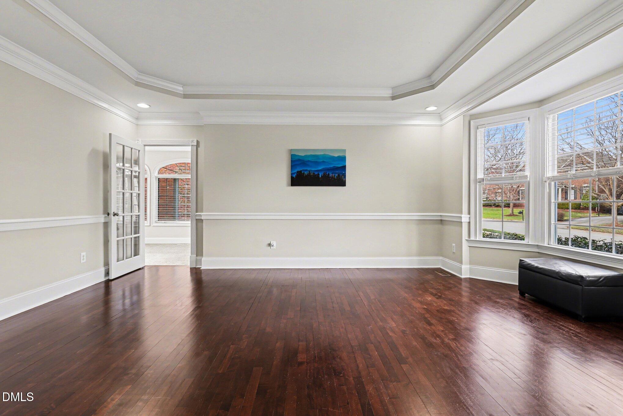10643 Tarton Fields Circle Raleigh, NC 27617 - Photo 25 of 53 a view of a livingroom with wooden floor and furniture