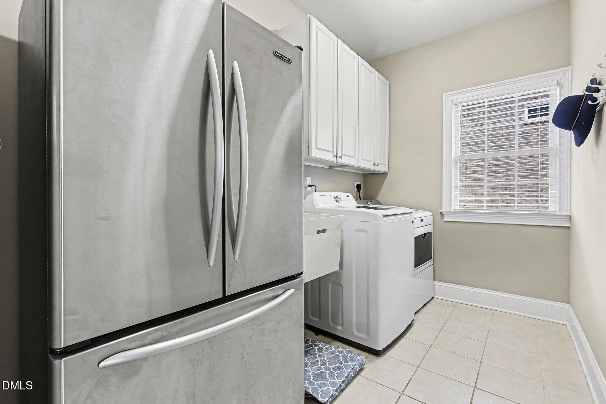 10643 Tarton Fields Circle Raleigh, NC 27617 - Photo 47 of 53 a utility room with window washer and dryer
