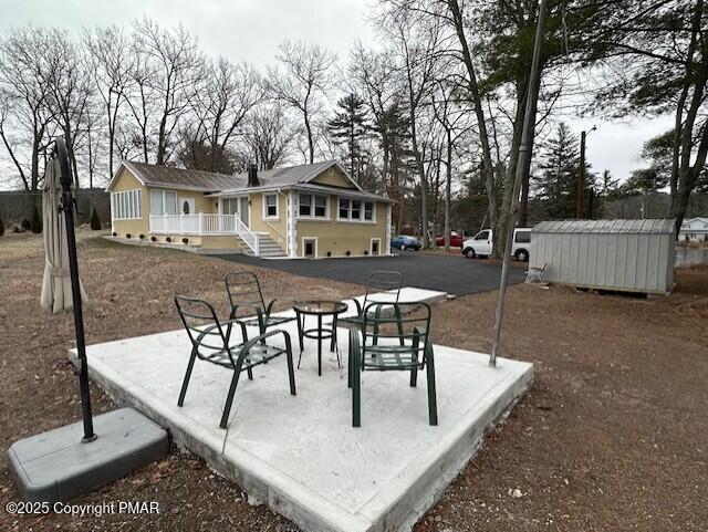 5130 Walnut Lane Kunkletown, PA 18058 - Photo 26 of 27 a view of a patio with a table and chairs