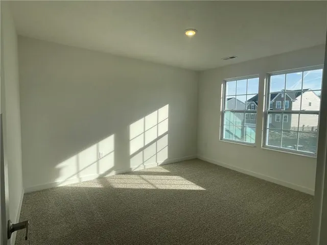 a kitchen with stainless steel appliances kitchen island granite countertop a stove a sink and a refrigerator with wooden floor