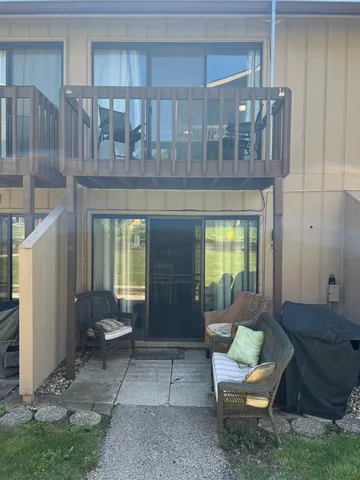a living room with furniture a window and a table