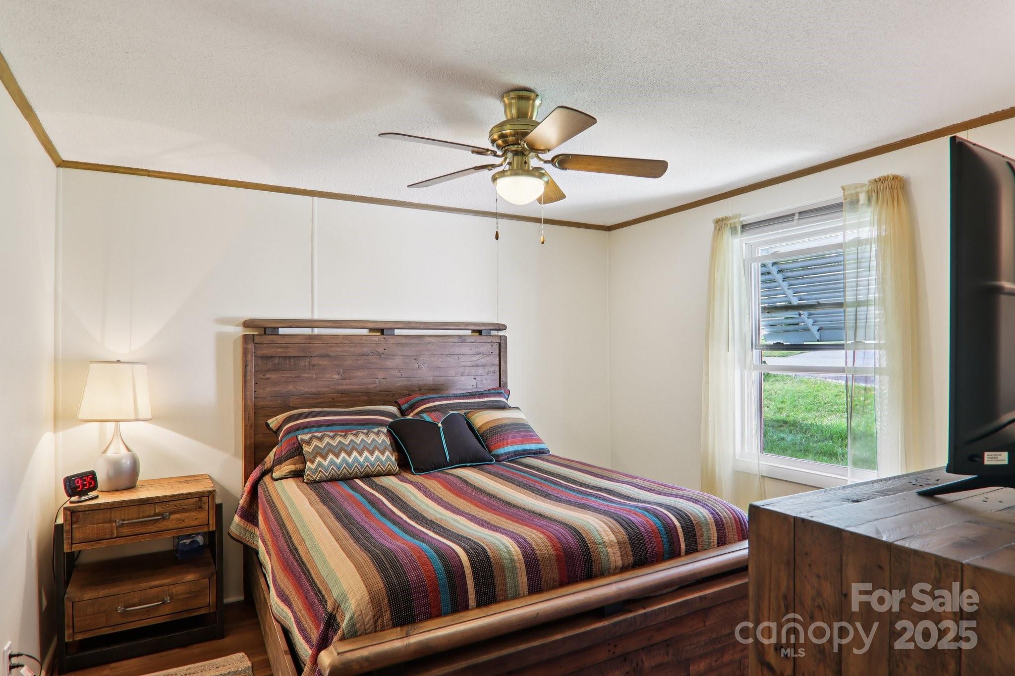 226 Cranbrook Circle Hendersonville, NC 28792 - Photo 18 of 47 a bedroom with a bed and window