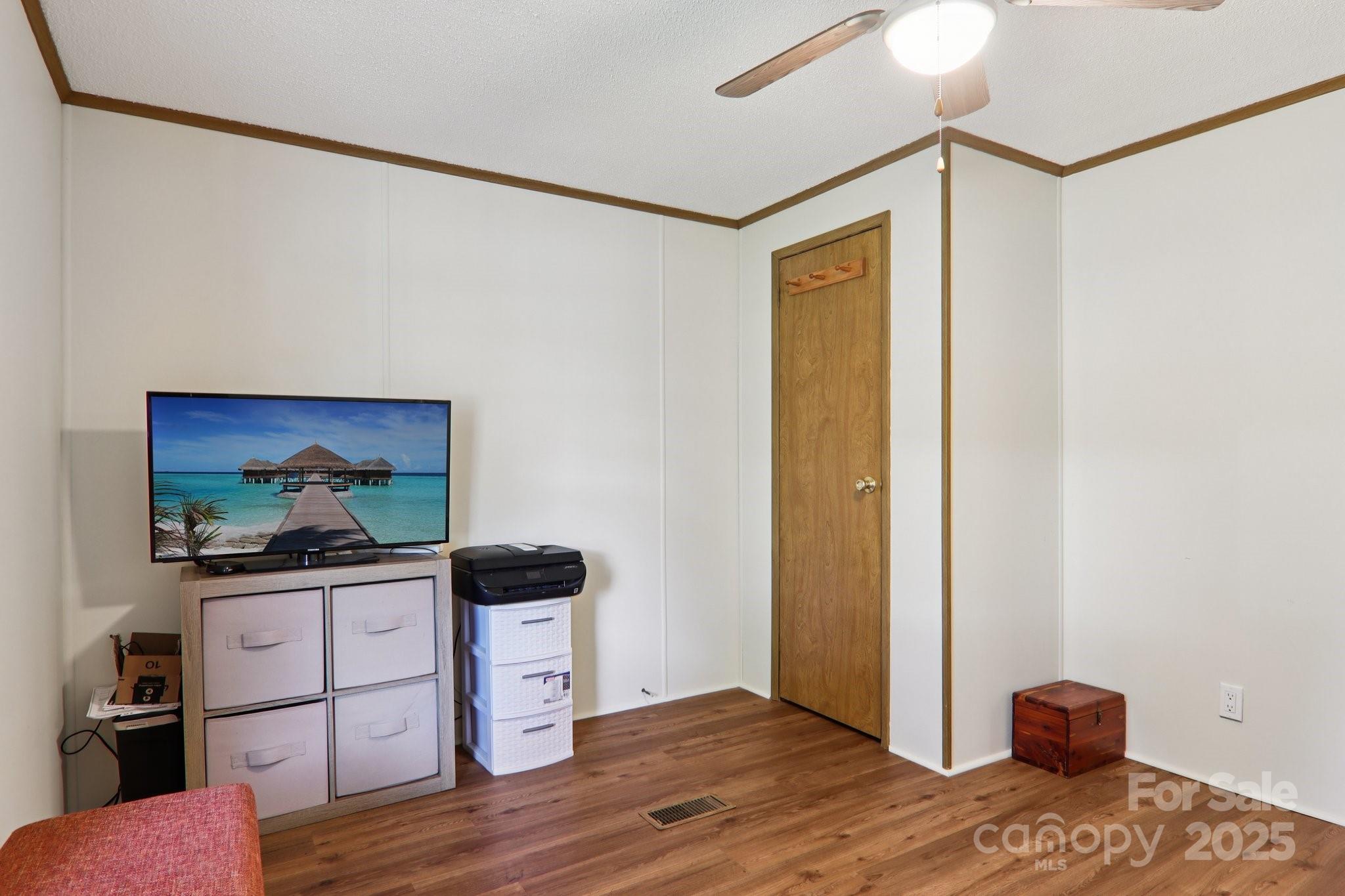 226 Cranbrook Circle Hendersonville, NC 28792 - Photo 25 of 47 a bedroom with a bed and a flat screen tv