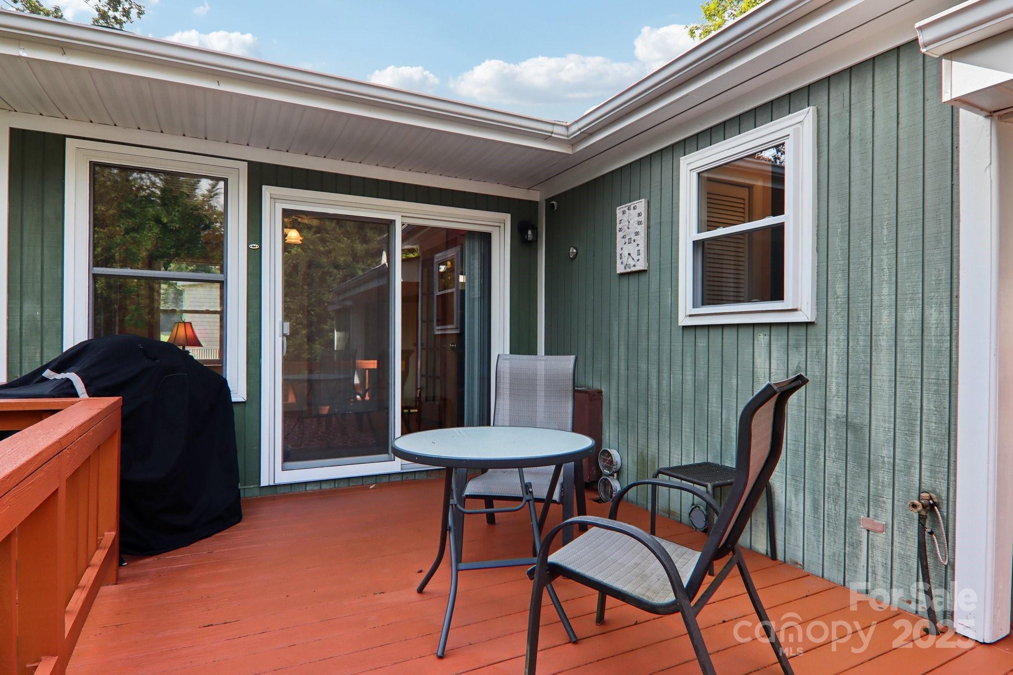 226 Cranbrook Circle Hendersonville, NC 28792 - Photo 34 of 47 a view of a balcony with furniture and a large window