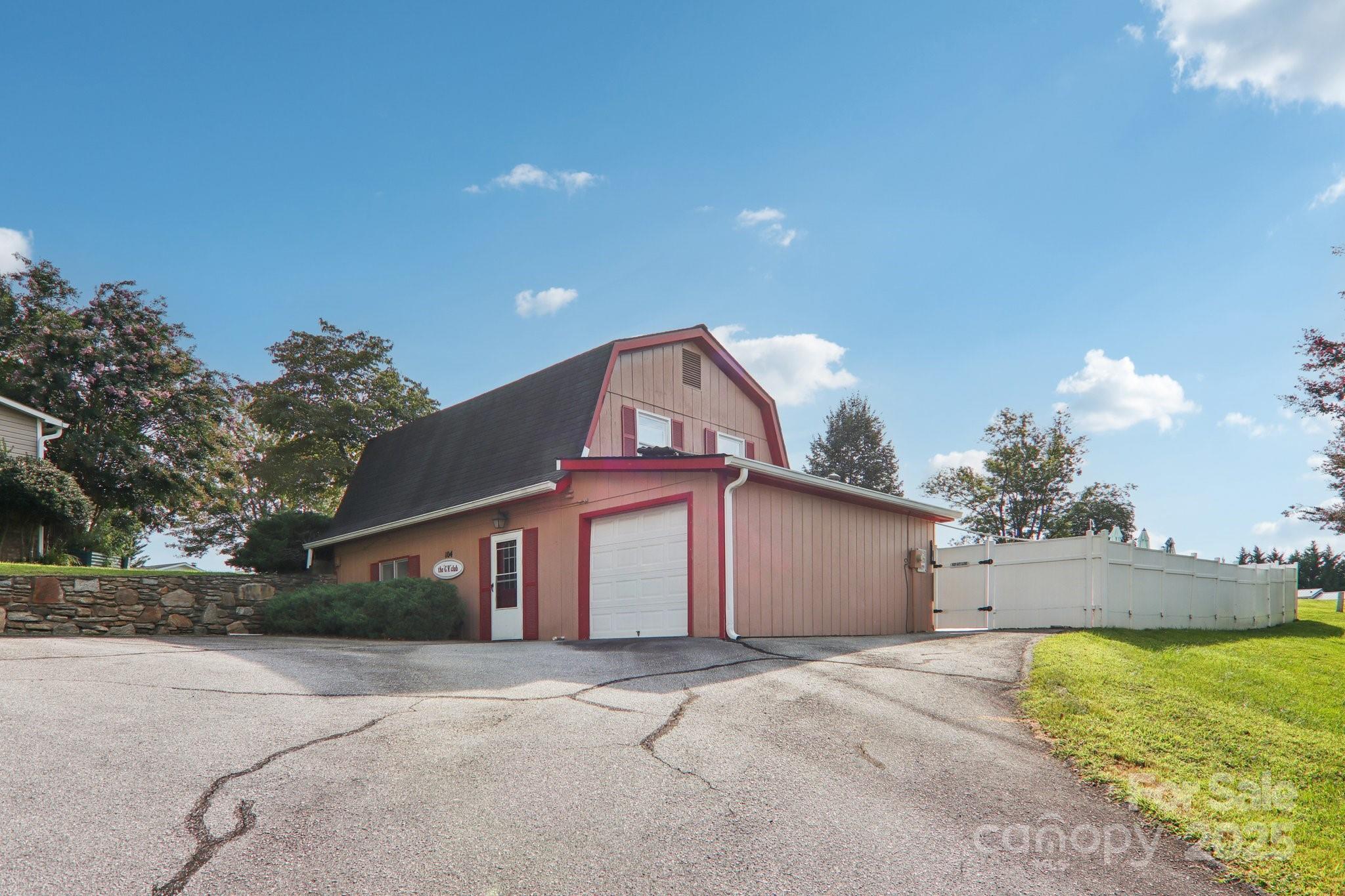 226 Cranbrook Circle Hendersonville, NC 28792 - Photo 42 of 47 a view of a house with a yard and garage