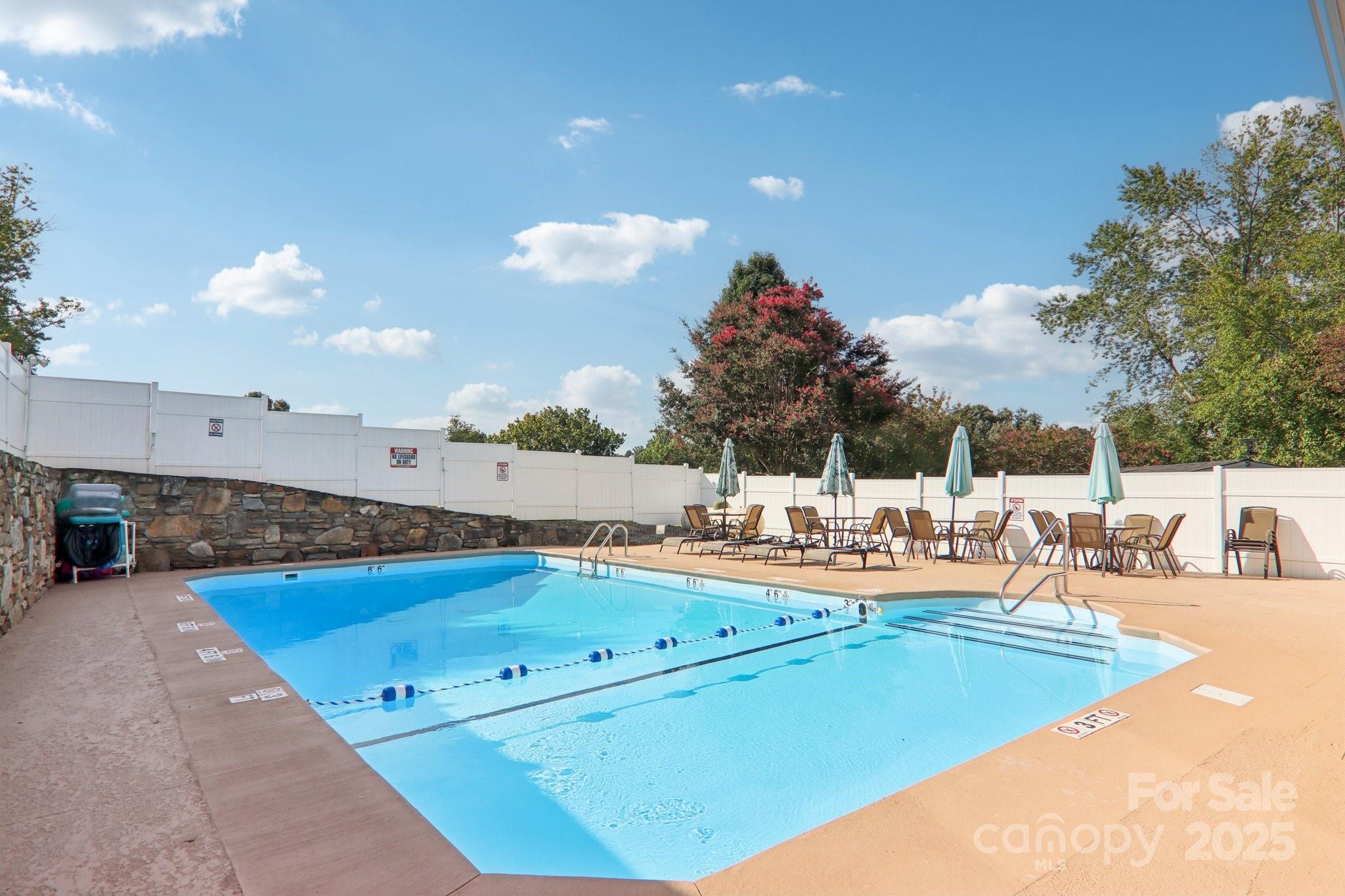 226 Cranbrook Circle Hendersonville, NC 28792 - Photo 43 of 47 a view of a swimming pool and a chairs