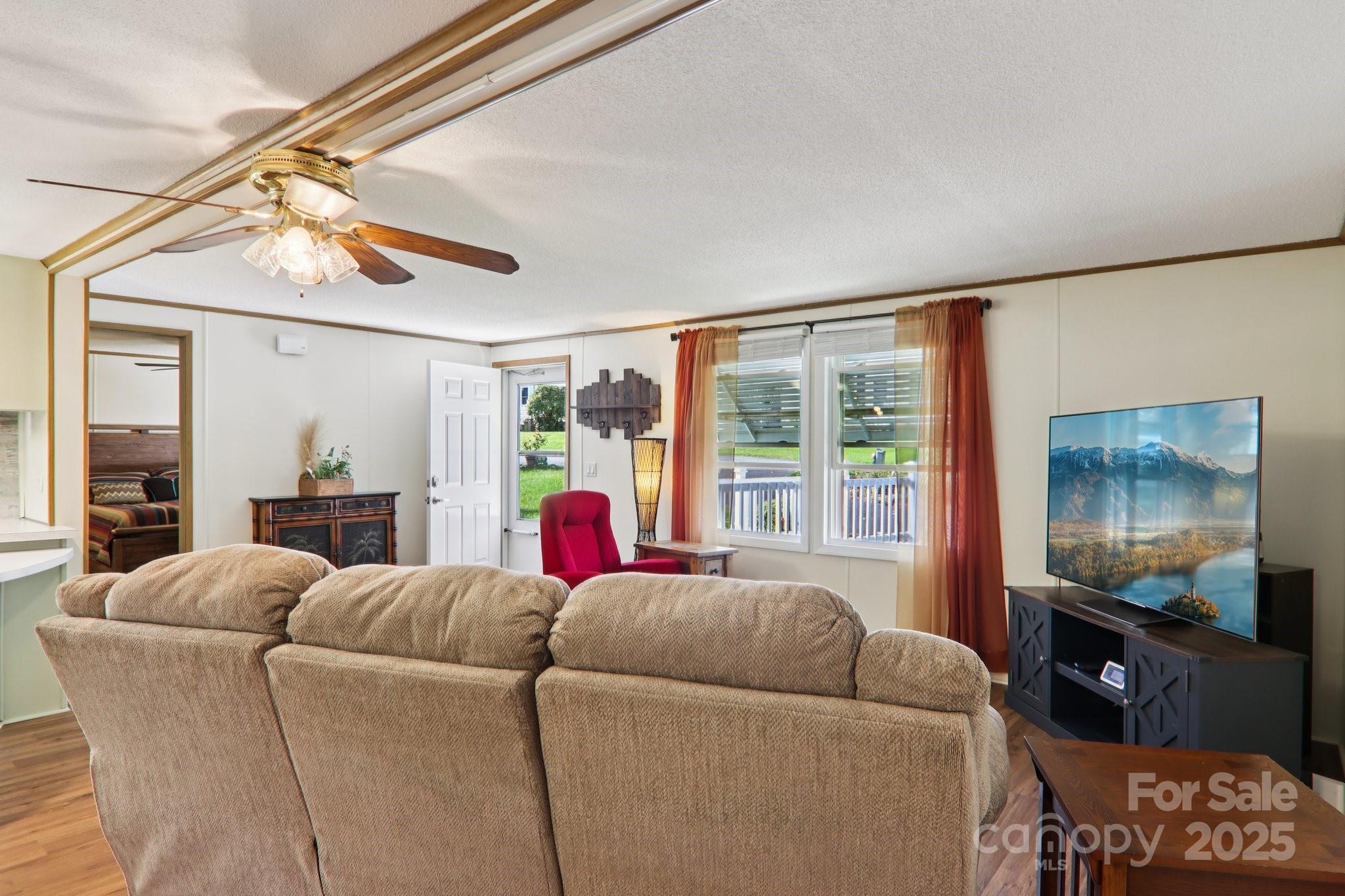 226 Cranbrook Circle Hendersonville, NC 28792 - Photo 10 of 47 a living room with furniture and a flat screen tv
