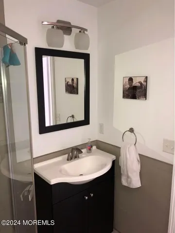 a bedroom with a bed and couch