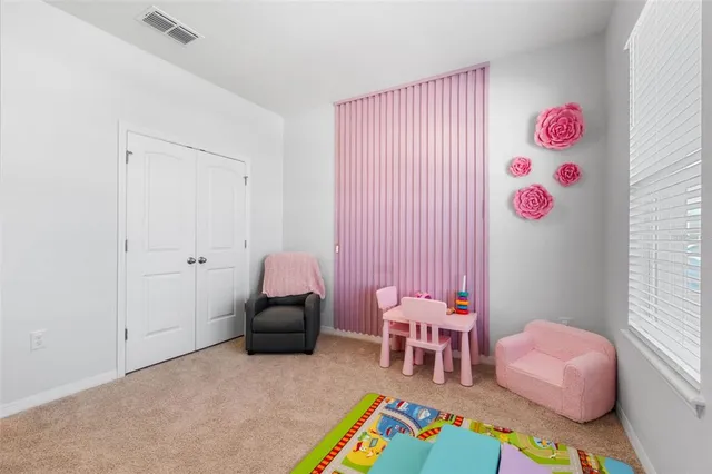 a bathroom with a granite countertop sink a toilet and a mirror