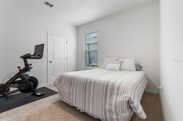 a bathroom with a granite countertop sink toilet and a mirror