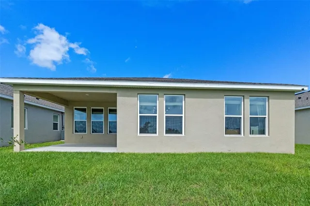 a aerial view of a house with a big yard