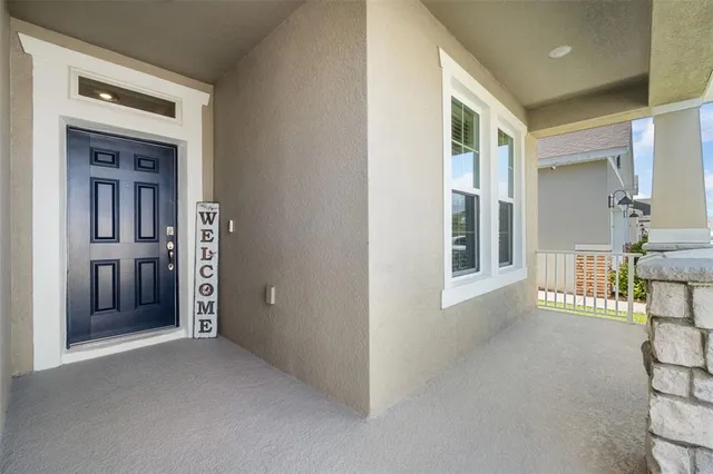 a view of a hallway with wooden shelves