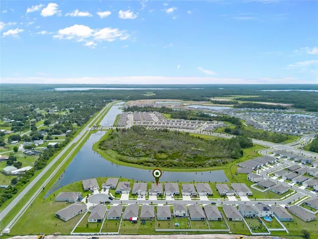 a view of yard with swimming pool and green space