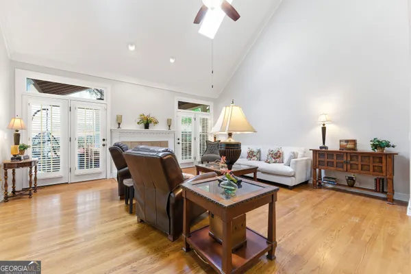 a view of a livingroom with a window and furniture