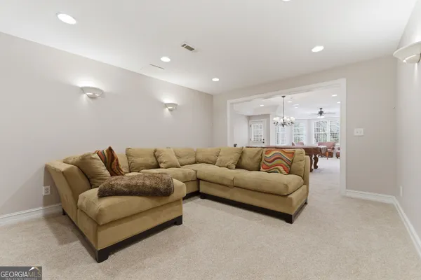 a view of a room with wooden floor and stairs