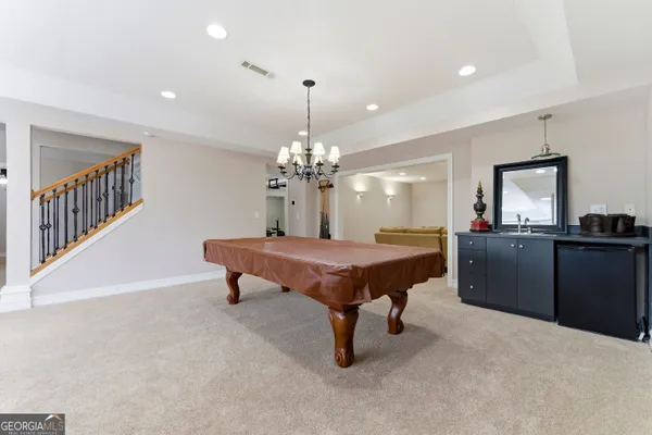 a view of a room with wooden floor and cabinet