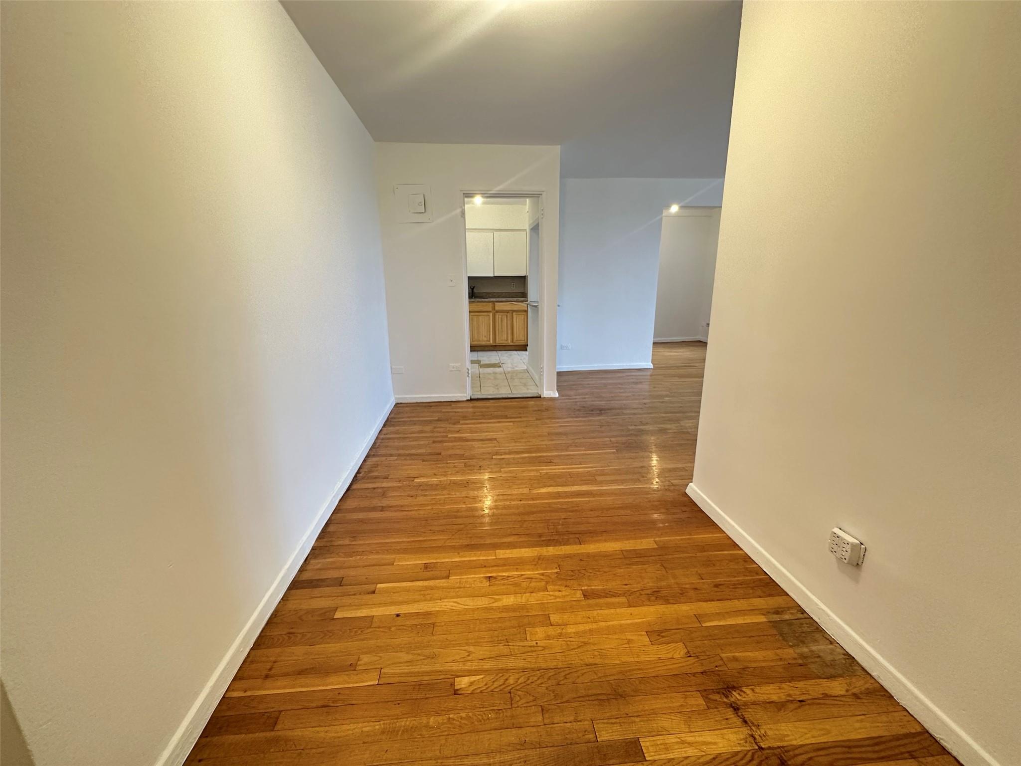 152-72 Melbourne Avenue, Unit 2P Queens, NY 11367 - Photo 5 of 8 Hallway with wood finished floors and baseboards