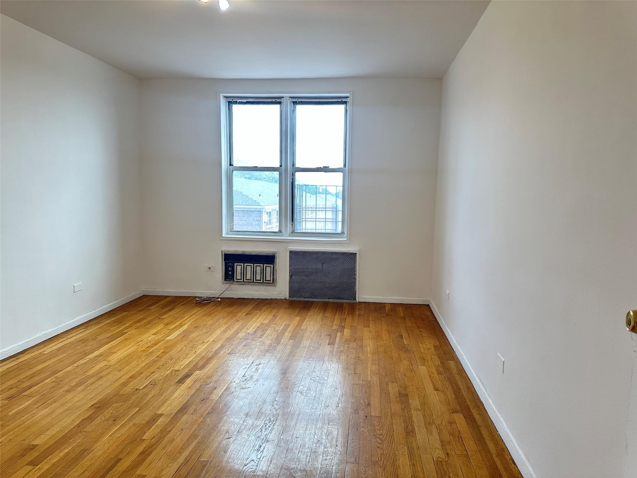 152-72 Melbourne Avenue, Unit 2P Queens, NY 11367 - Photo 6 of 8 Spare room with hardwood / wood-style flooring and baseboards