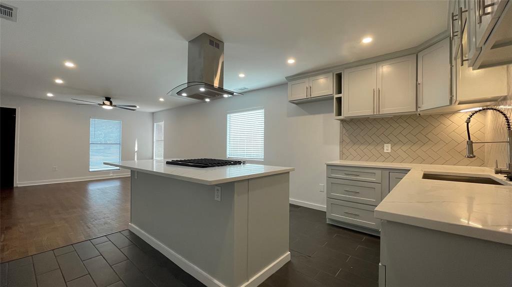 2931 Ivandell Avenue Dallas, TX 75211 - Photo 1 of 1 a kitchen with a sink stainless steel appliances and cabinets