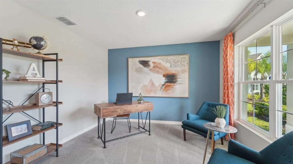 17563 Acorn Drop Road Land O Lakes, FL 34638 - Photo 7 of 23 a workspace with furniture and a window